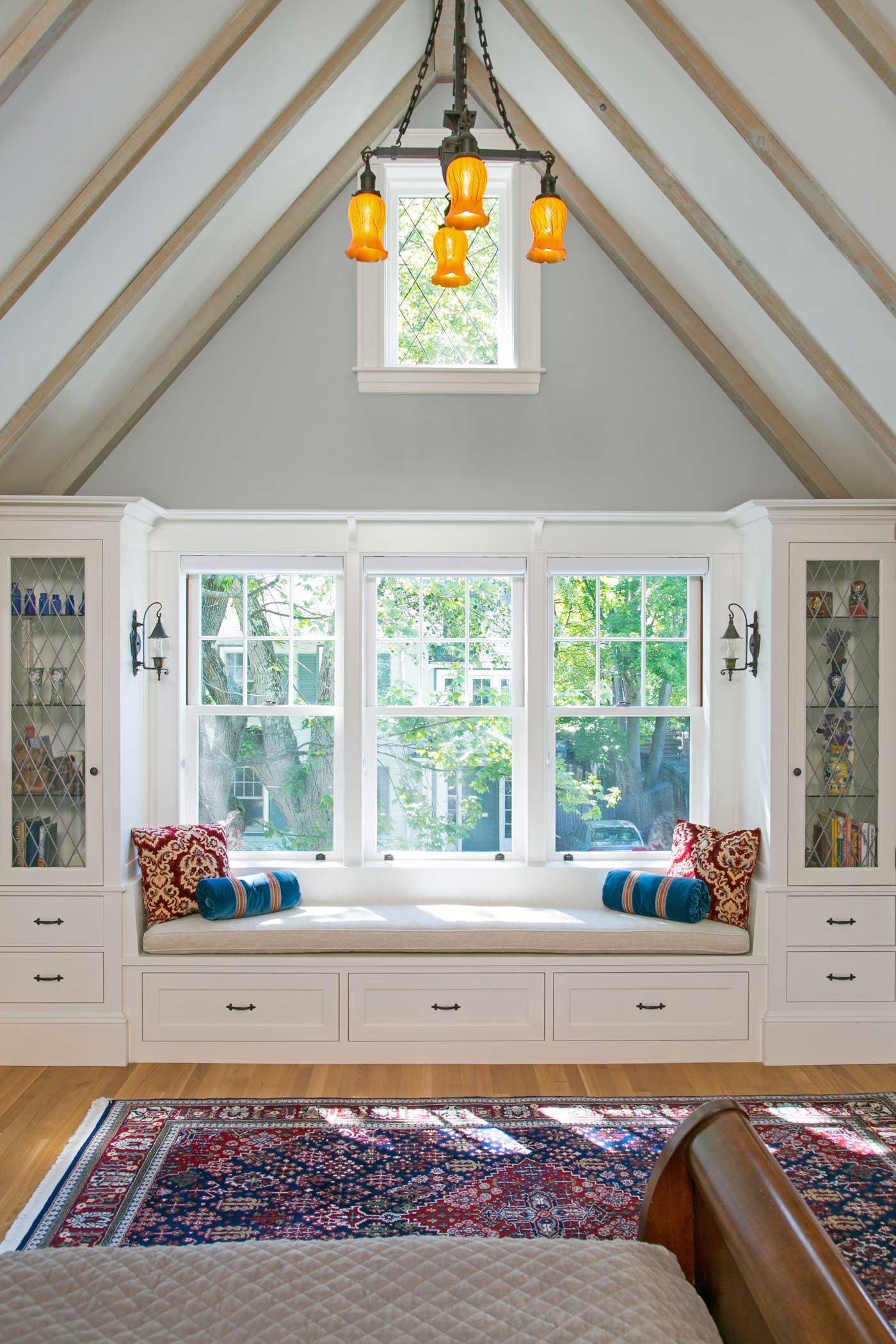 window seat in family room with cathedral ceilings