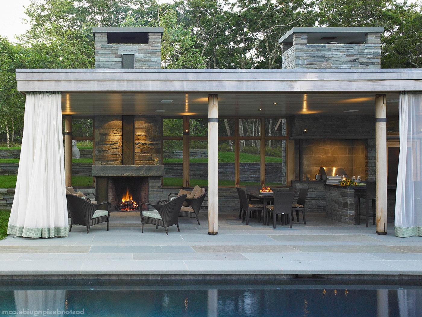 Coastal pool house with a fireplace by Jill Neubauer Architects
