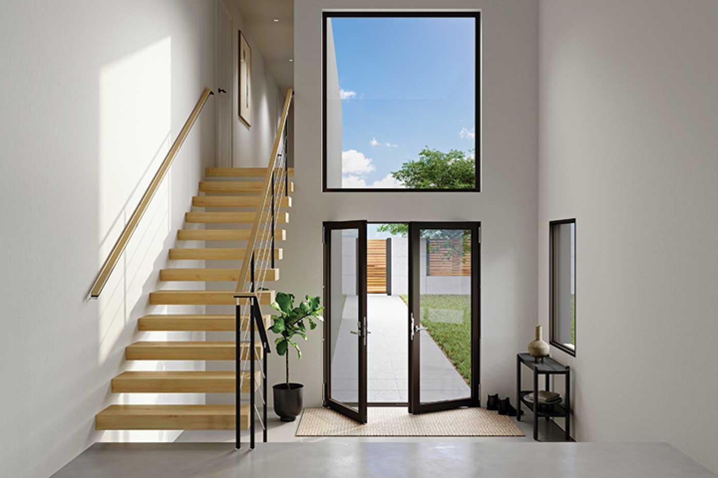 front entry way with open glass doors and a stairway to the right