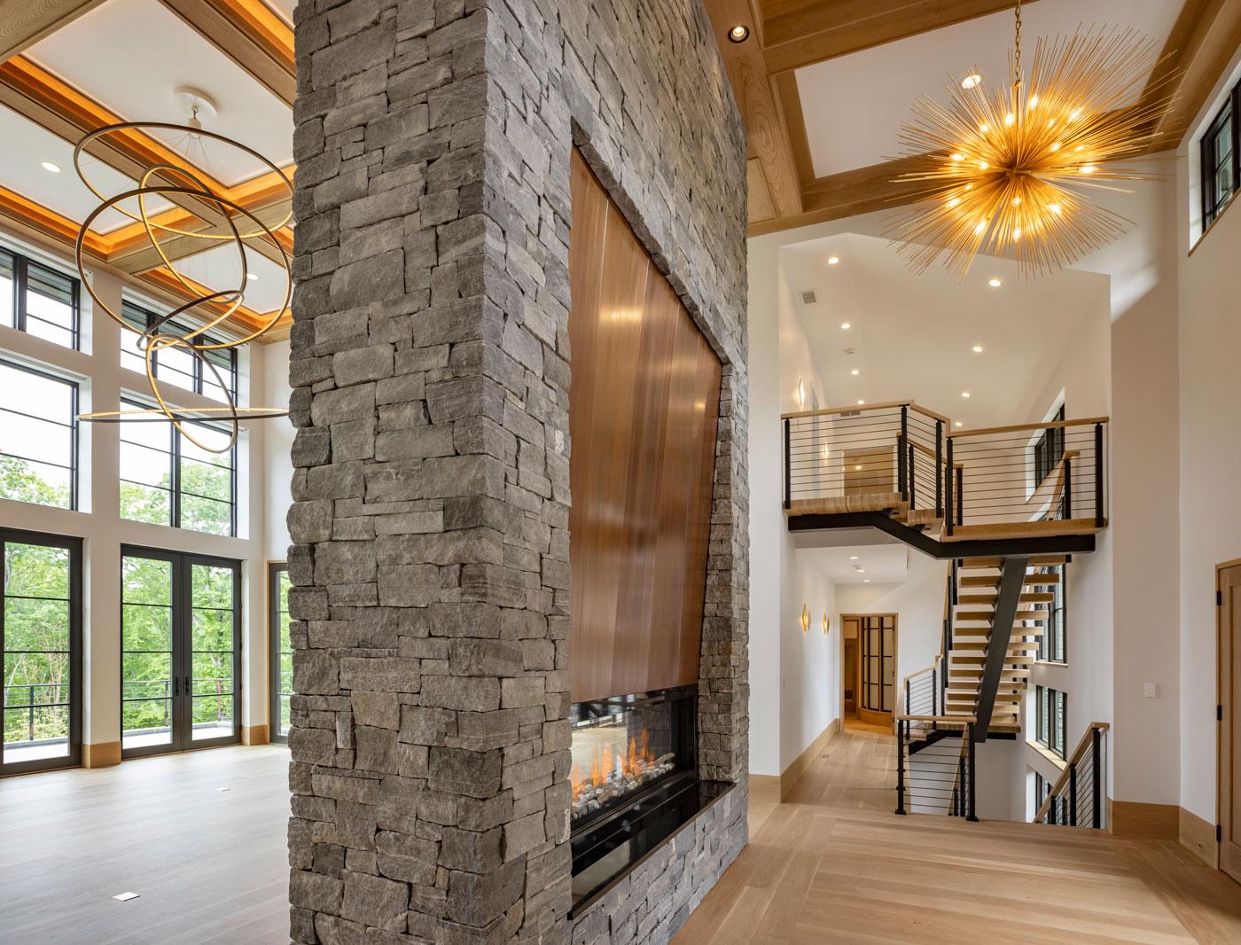 open floor plan of modern house with a fireplace in the middle