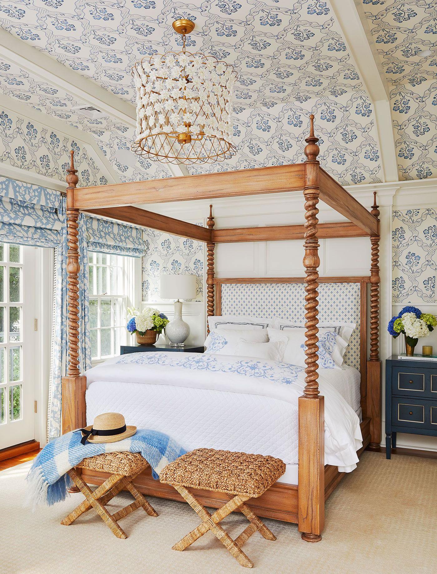 Bedroom with ceiling wallpaper and flower chandelier
